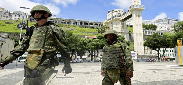 Soldiers patrol the city center during a police strike in Salvador