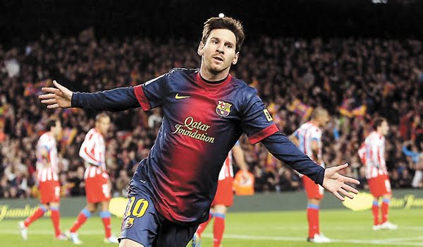 Barcelona's Lionel Messi celebrates his goal against Atletico Madrid during their Spanish first division soccer match at Nou Camp stadium in Barcelona