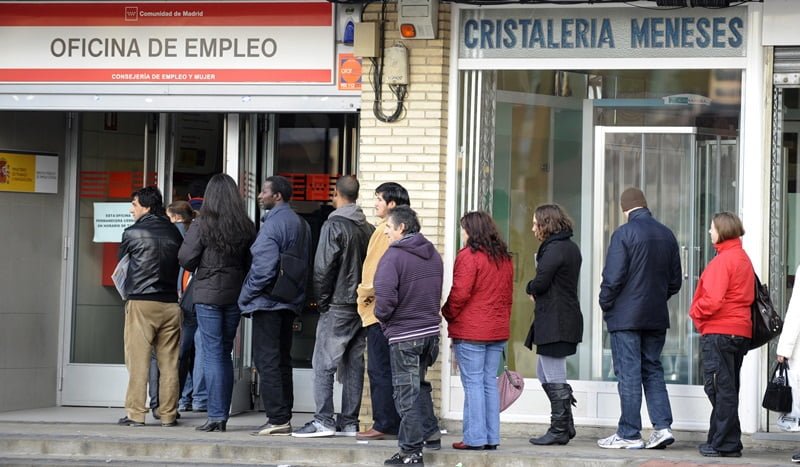 People wait in line at a government employment office at Santa Eugenia's Madrid suburg on January 20, 2010. The Spanish economy, the fifth largest in Europe, entered its first recession in 15 years at the end of 2008 as the global financial crisis hastened a correction that was already underway in its once-buoyant property sector. The downturn has sent the unemployment rate soaring to nearly 20 percent, the second-highest rate in the 27-nation European Union, leading to a drop in consumer demand.AFP PHOTO/DOMINIQUE FAGET (Photo credit should read DOMINIQUE FAGET/AFP/Getty Images)