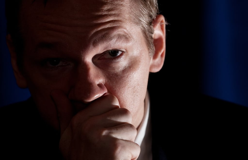 FILES - Founder of the Wikileaks website Julian Assange coughs as he speaks to the media on October 23, 2010 at the Park Plaza hotel in central London. Ecuador was set to announce on August 16, 2012 whether it would grant asylum to WikiLeaks founder Julian Assange but authorities in London warned preemptively they would not allow him to leave Britain. AFP PHOTO / Leon Neal