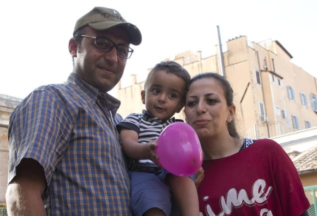 Syrian refugee Nour Essa, second from right, her husband Hasan Zaheda and their two-year-old son Riad pose for a photo during an interview with the Associated Press at the St. Egidio Roman Catholic Charity, in Rome, Sunday, April 17, 2016. Nour and her family are part of three Muslim families that Pope Francis flew back with him to Italy from Greece, where they were in a refugee camp on the island of Lesbos.  (AP Photo/Alessandra Tarantino)